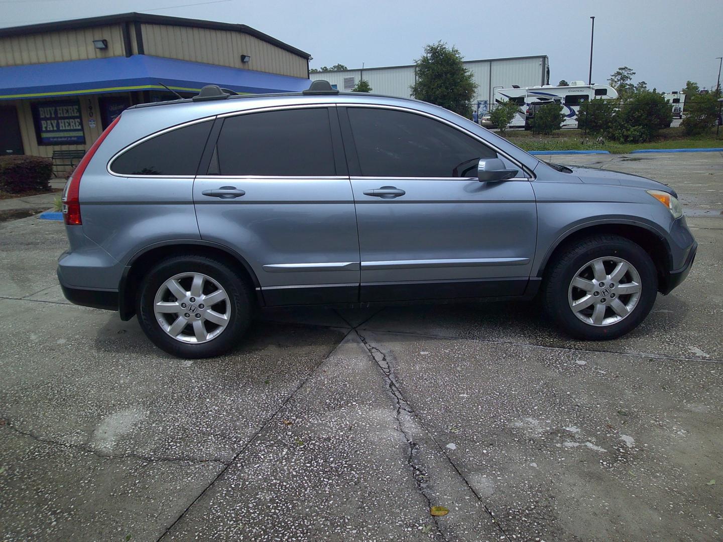 2009 BLUE HONDA CR-V EX-L (JHLRE48749C) , located at 10405 Abercorn Street, Savannah, GA, 31419, (912) 921-8965, 31.988262, -81.131760 - Photo#2